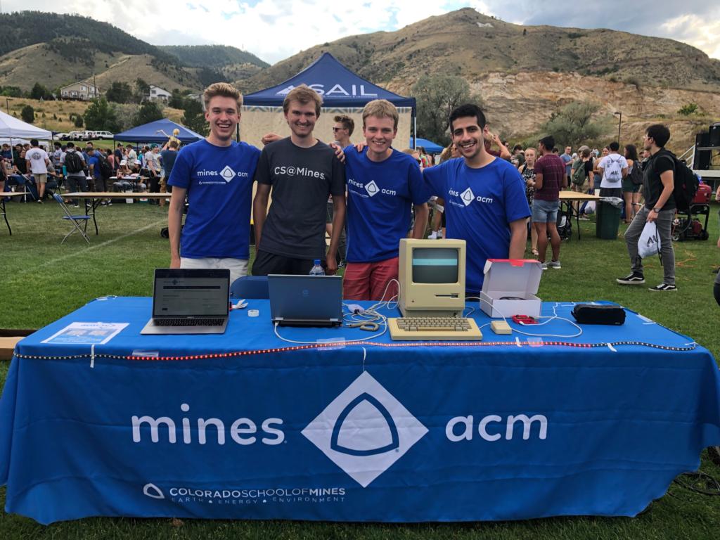 ACM's booth at the 2021 Celebration of Mines, feature a music-synced light show display, and a retro Mac